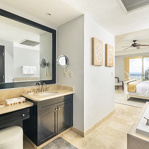 en suite bathroom with whirlpool bathtub