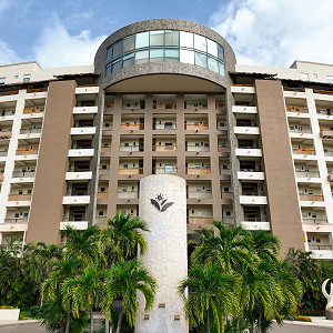 Close-up of the main building entrance and resort logo monument
